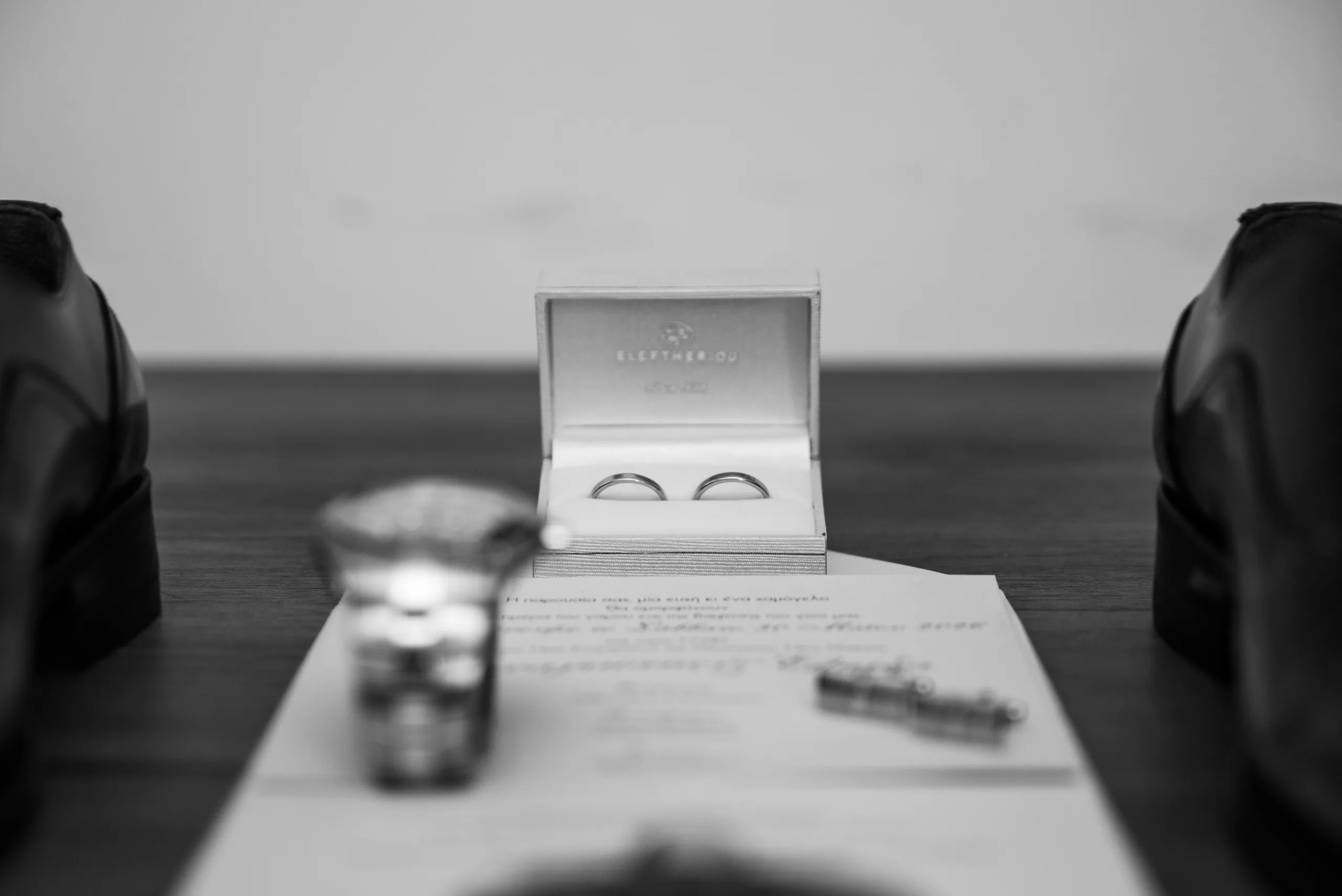 Black-and-white photo of the wedding rings in their box